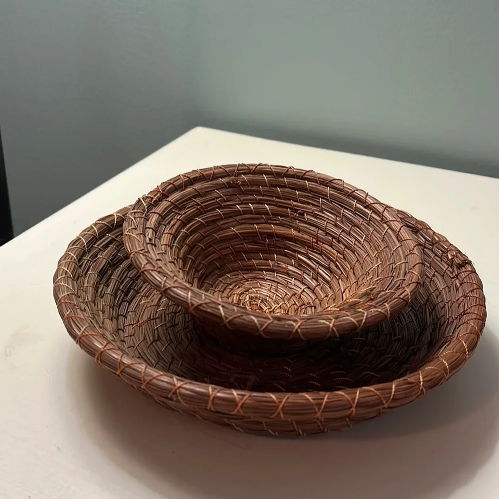 Set of 2 small woven baskets.
